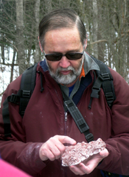 Jim Halfpenny examining plaster cast from snow